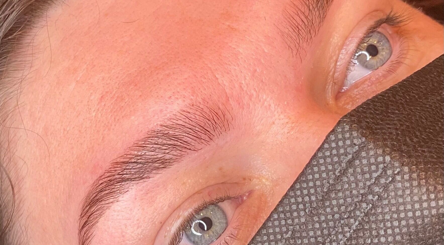 Close-up of perfectly shaped eyebrows at Bombshell Boutique Beauty, Bracknell, England, GB.