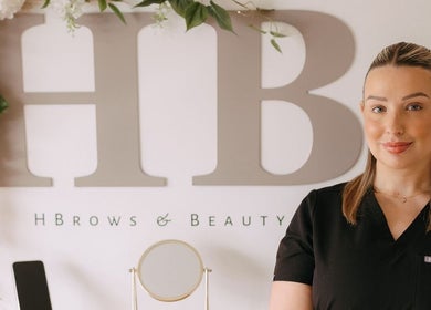 H B R O W S & B E A U T Y in Lightwater, England. Welcoming atmosphere with floral decor and friendly staff.