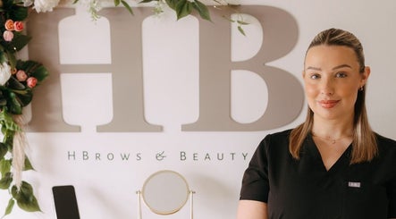 H B R O W S & B E A U T Y in Lightwater, England. Welcoming atmosphere with floral decor and friendly staff.