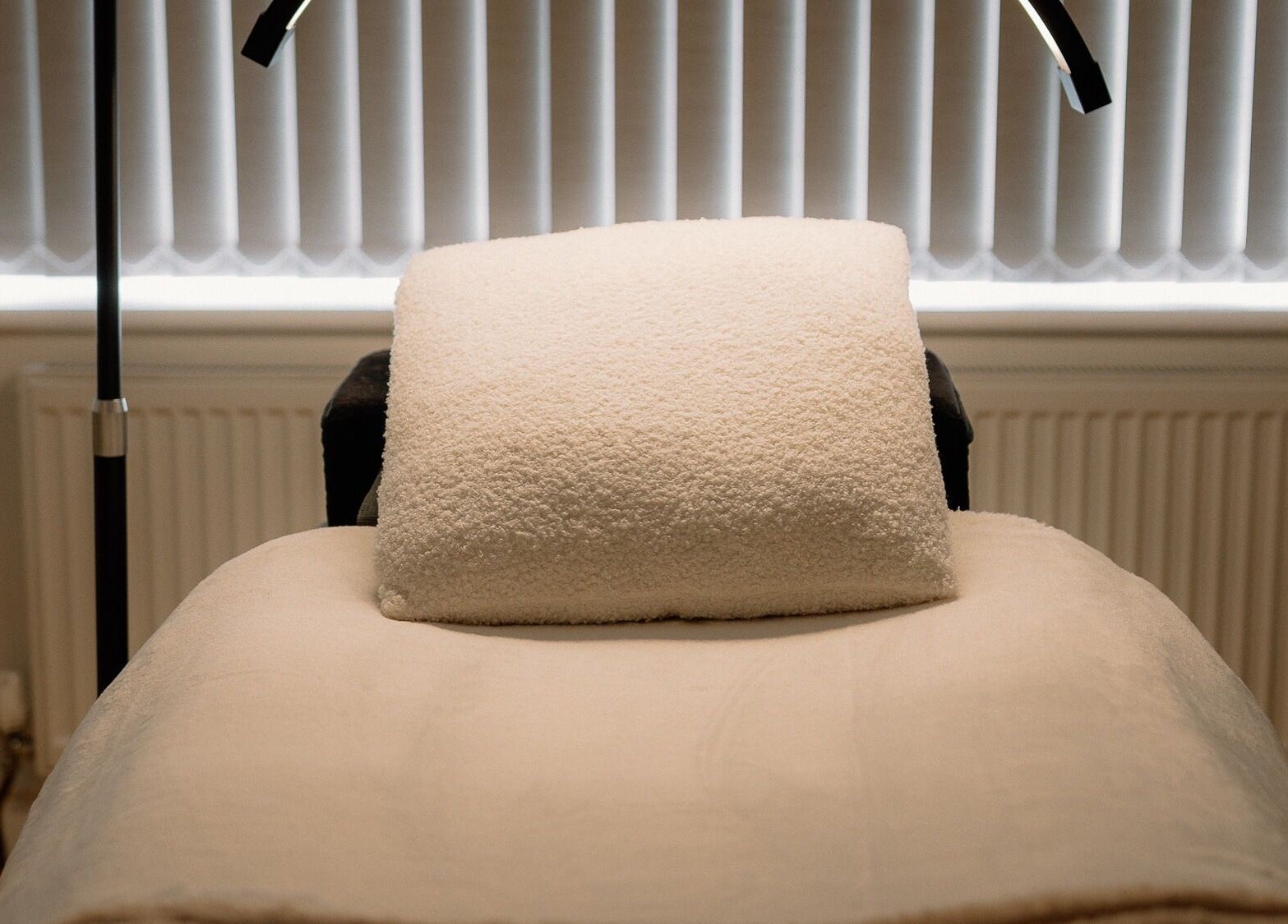 Comfortable treatment bed at H Brows & Beauty in Lightwater, England, GB, ready for relaxing wellness therapies.