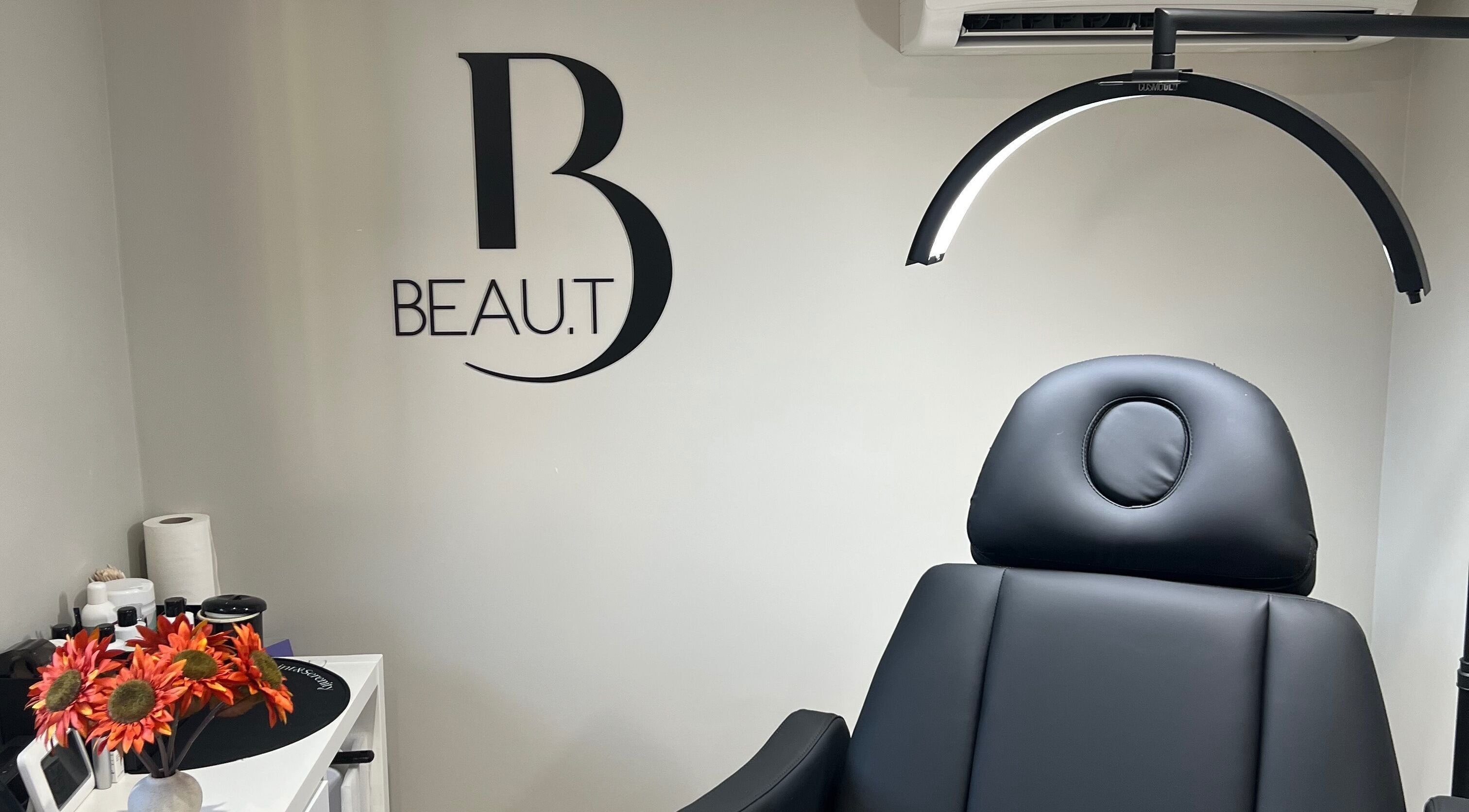 Interior of Beau.t in Southwater, England featuring a modern black spa chair and elegant decor.
