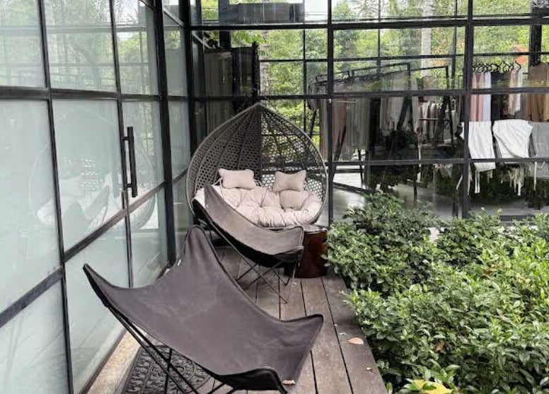 Stylish outdoor seating at Muka Concepts Jalan Green School, Sibang Kaja, Bali, ID, amid lush greenery.