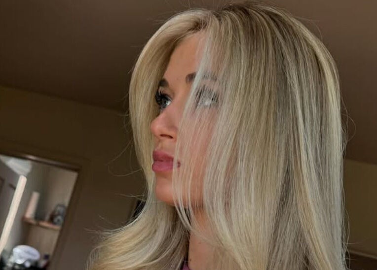 Client with styled blonde hair at Studio Phoebe, Darsham, England, GB emphasizing luxury beauty services.