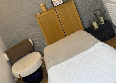 Cozy therapy room at Blush Beauty Suite, Yeadon, England, GB, featuring a comfortable treatment bed and decor.
