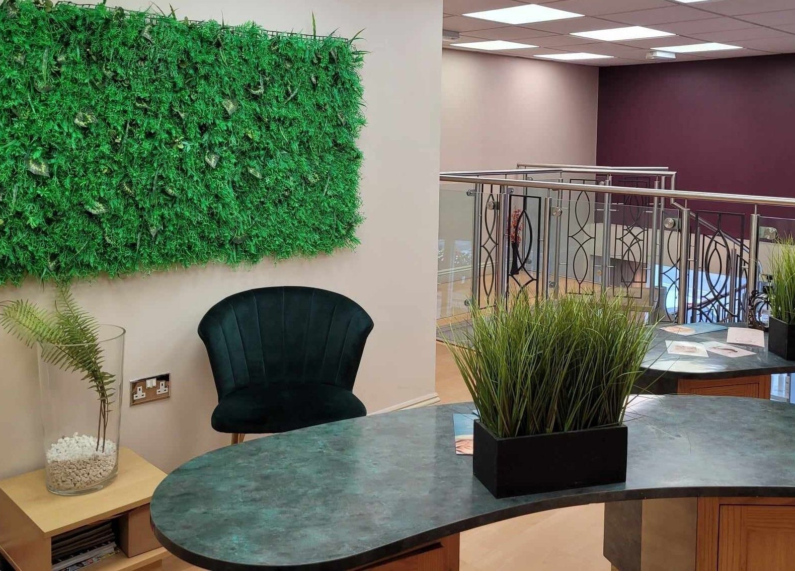 Lounge area in Lamis Aesthetics, Timperley, England, GB featuring green decor and elegant seating.