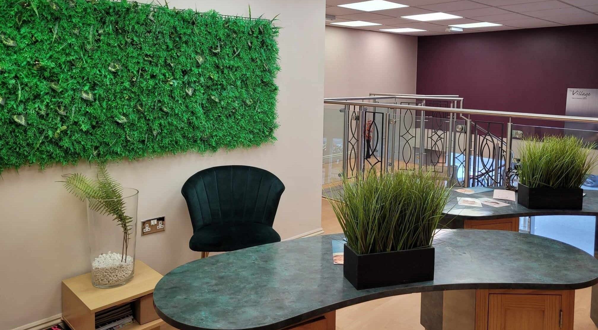 Lounge area in Lamis Aesthetics, Timperley, England, GB featuring green decor and elegant seating.