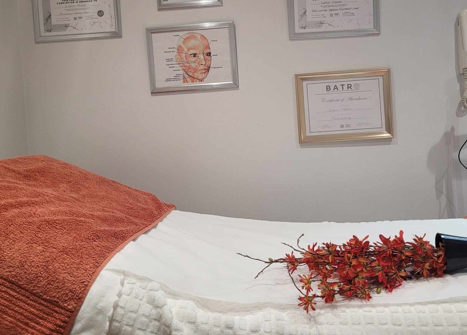 Relaxing treatment room at Lamis Aesthetics, Timperley, England, GB, highlighting tranquil decor and professional setup.