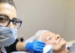 Professional skincare treatment at Lamis Aesthetics, Timperley, England, GB, rejuvenating client's complexion.