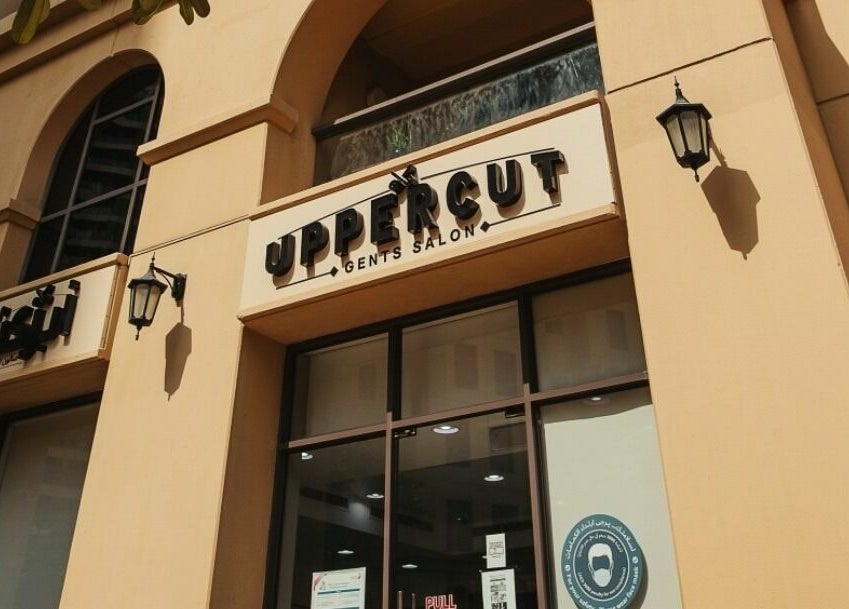 Exterior of Uppercut Gents Salon at Jumeirah Beach Residences, Dubai, UAE, showcasing stylish signage.