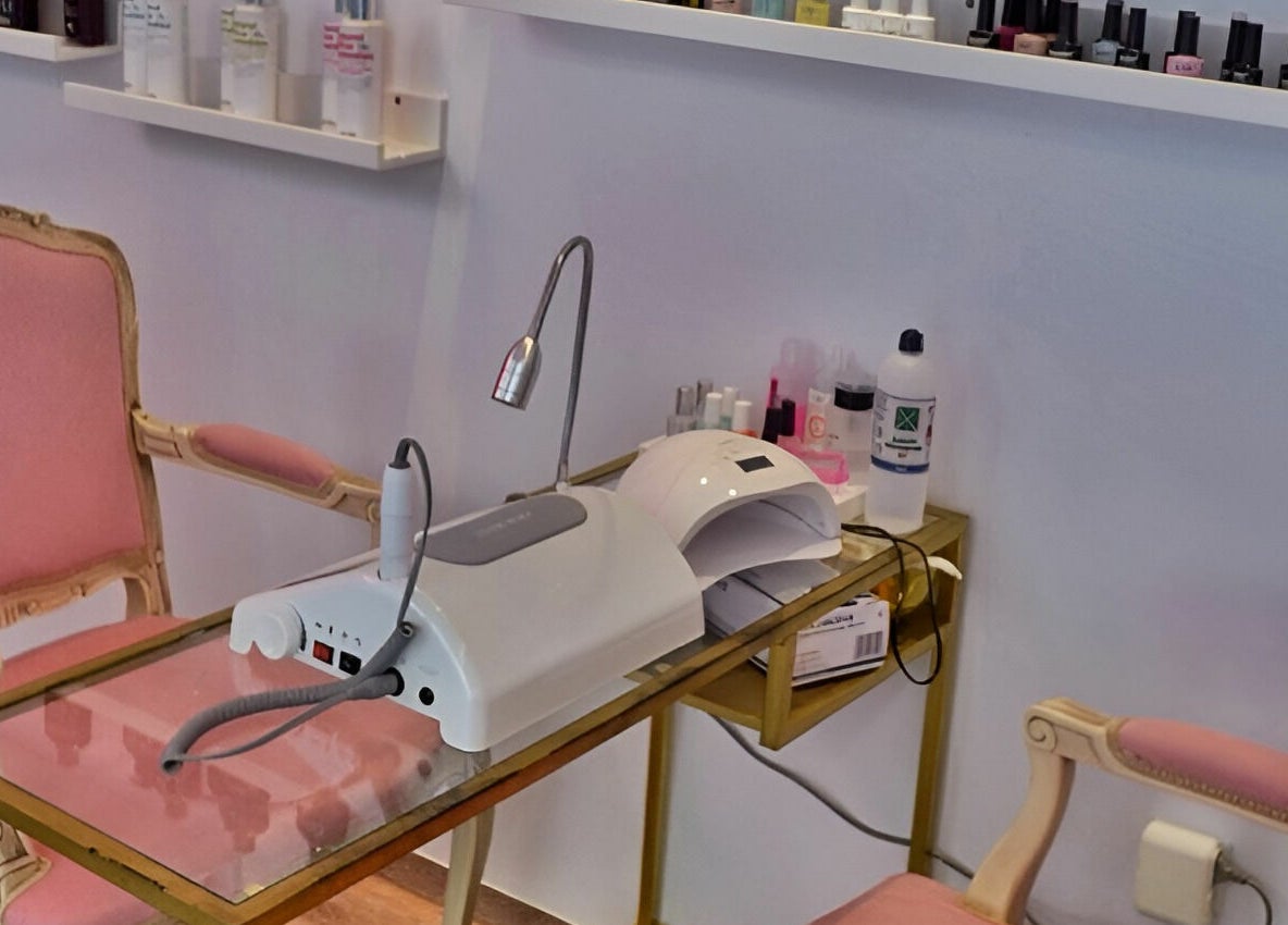 Oh My Spa manicure setup with pink chairs and nail tools in Argostoli, GR.