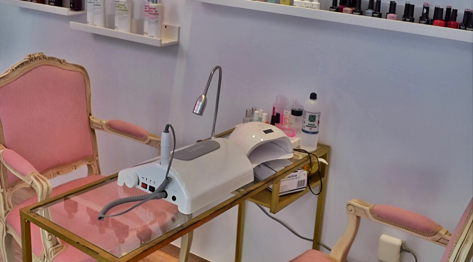 Oh My Spa manicure setup with pink chairs and nail tools in Argostoli, GR.