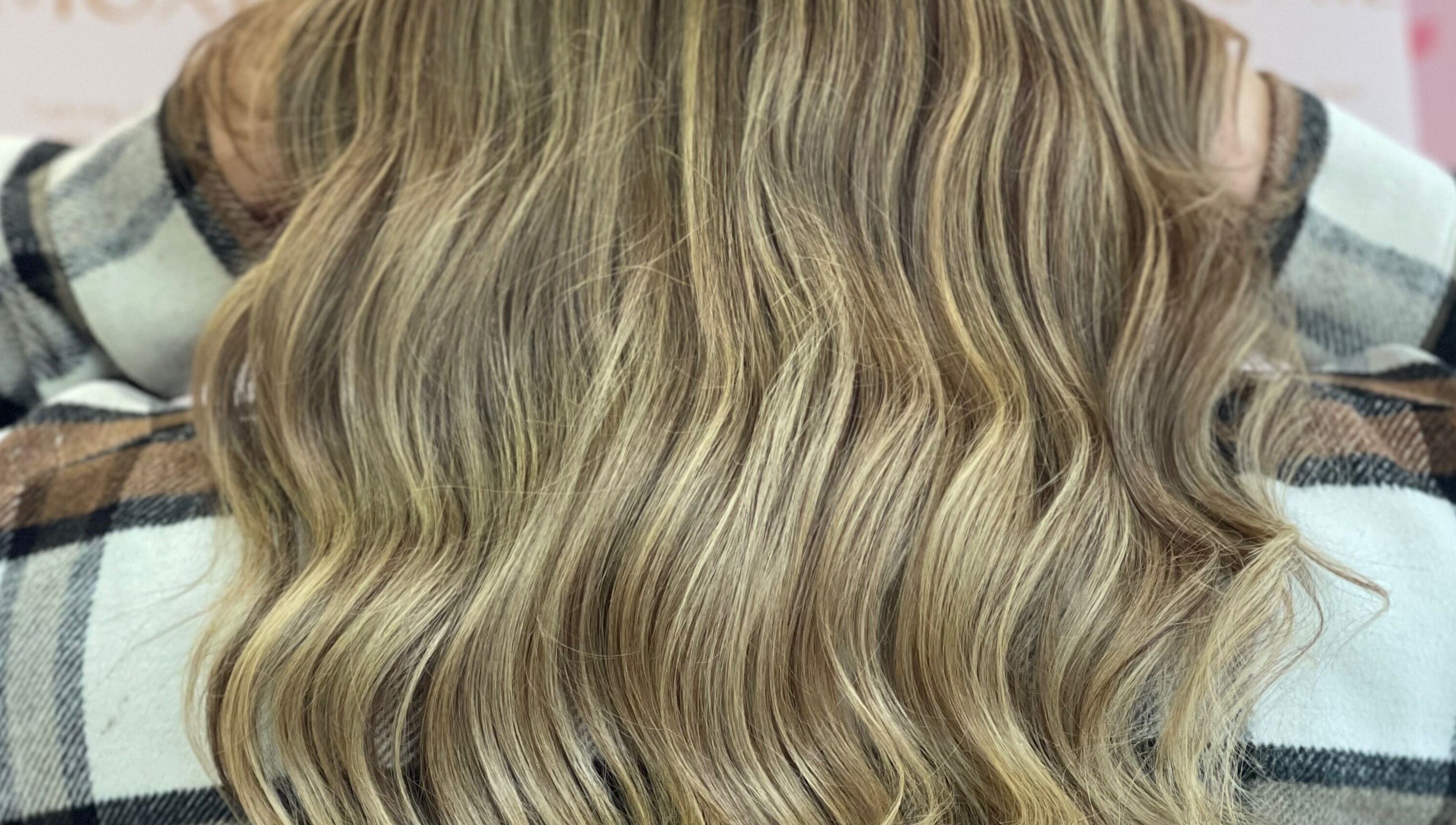 Blonde wavy hair close-up at Moxie at Dreamhair, Shrewsbury, England, GB showcasing natural highlights.