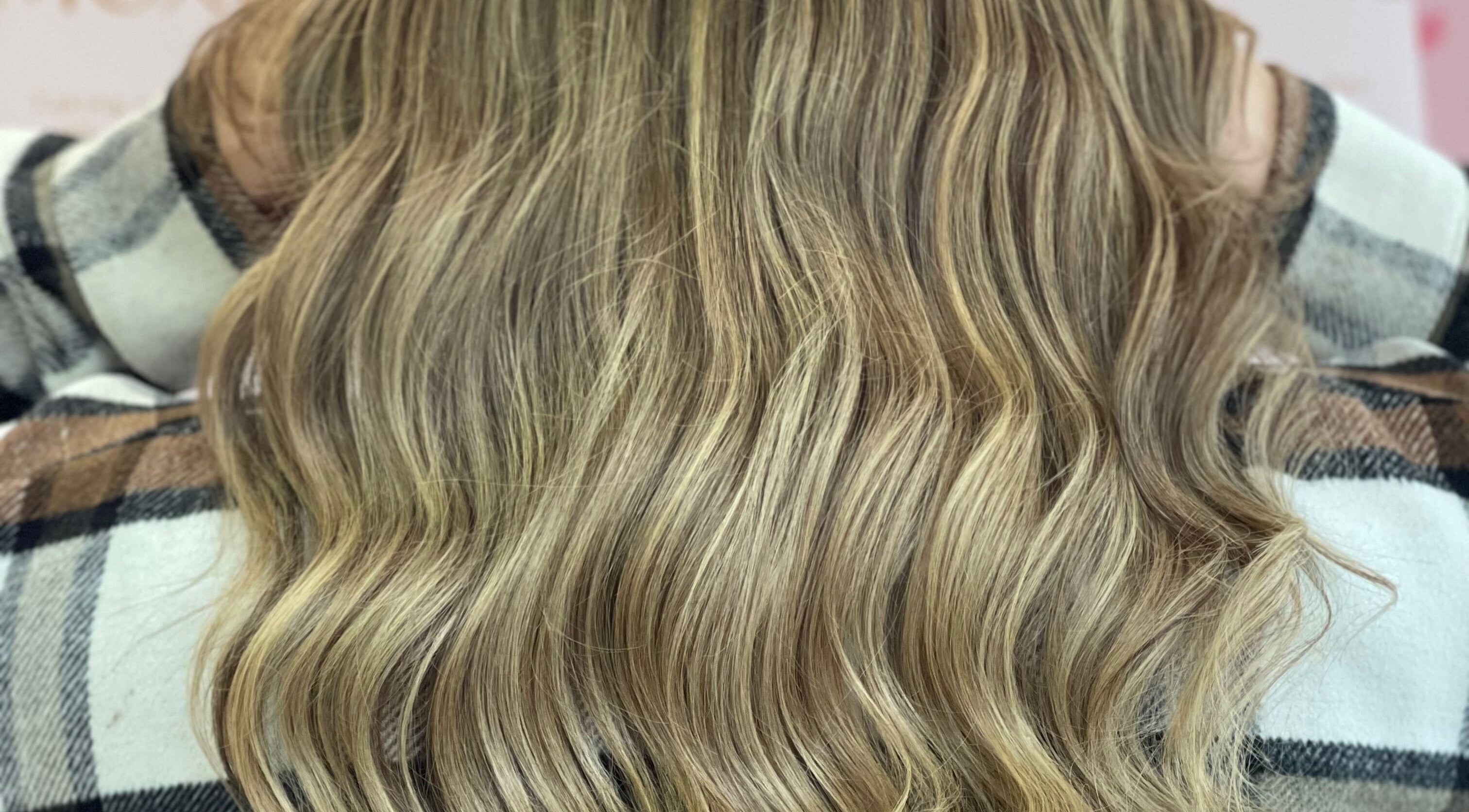 Blonde wavy hair close-up at Moxie at Dreamhair, Shrewsbury, England, GB showcasing natural highlights.