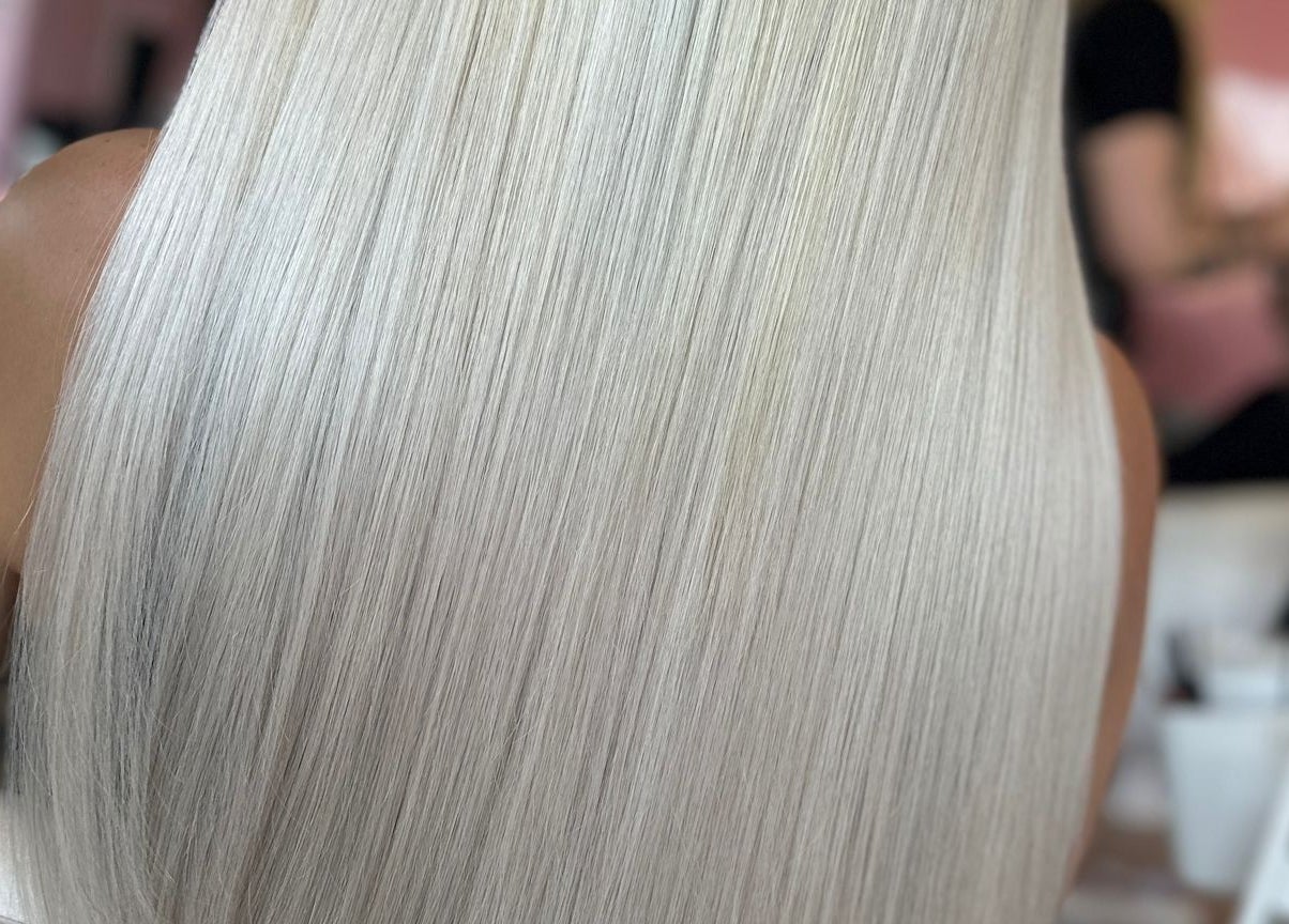 Smooth, platinum blonde hair styled perfectly at Moxie at Dreamhair in Shrewsbury, England, GB.