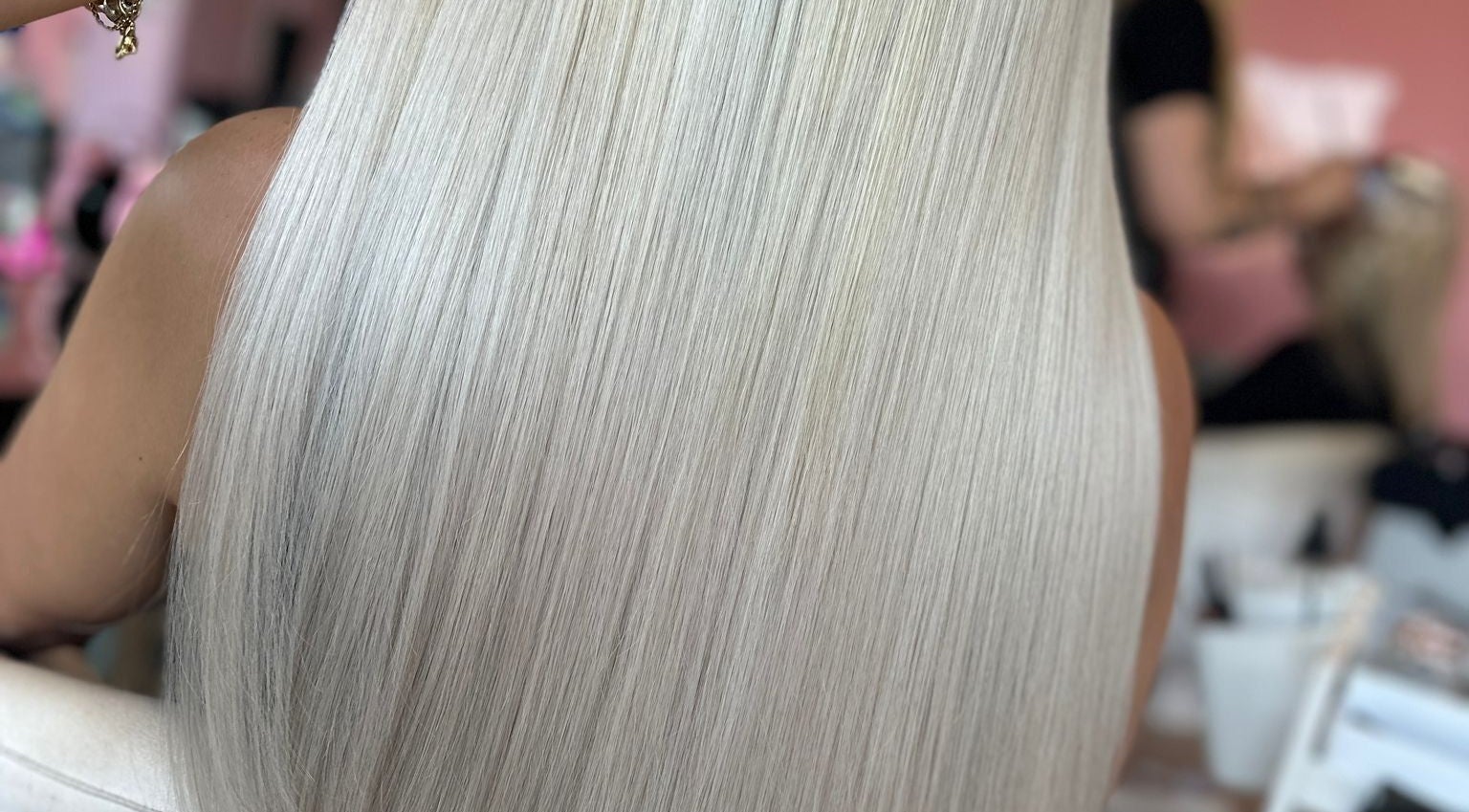 Smooth, platinum blonde hair styled perfectly at Moxie at Dreamhair in Shrewsbury, England, GB.