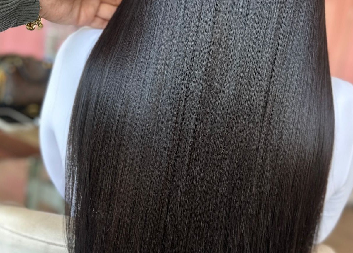 Sleek, straight hair styled at Moxie at Dreamhair, Shrewsbury, England, GB, showcasing a glossy shine.