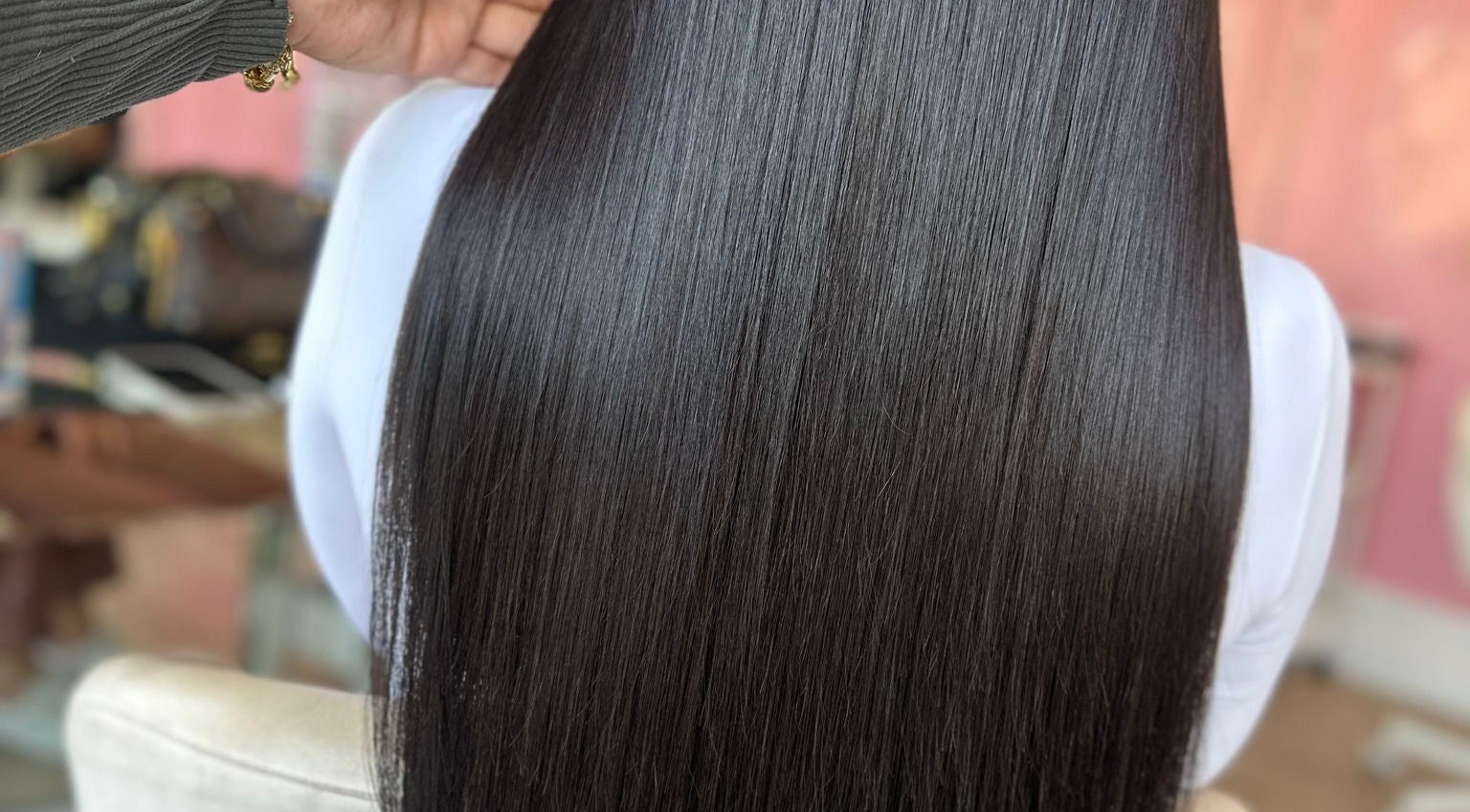 Sleek, straight hair styled at Moxie at Dreamhair, Shrewsbury, England, GB, showcasing a glossy shine.