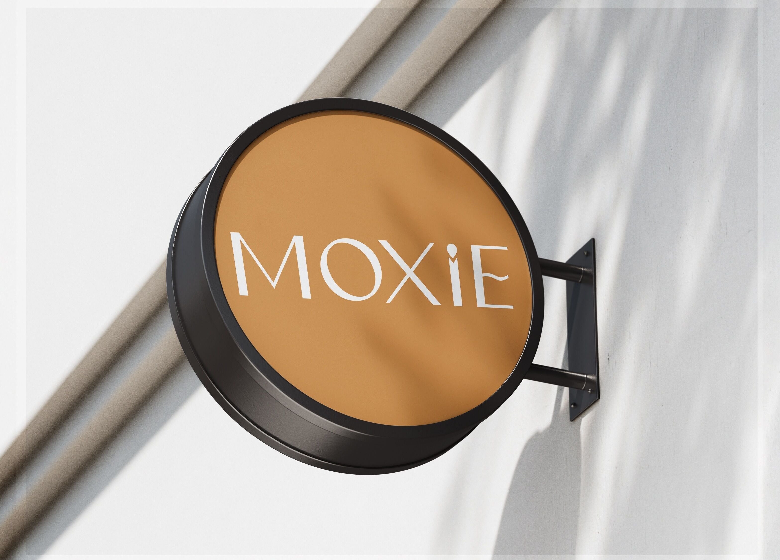 Moxie at Dreamhair signboard displayed on a wall in Shrewsbury, England, GB.