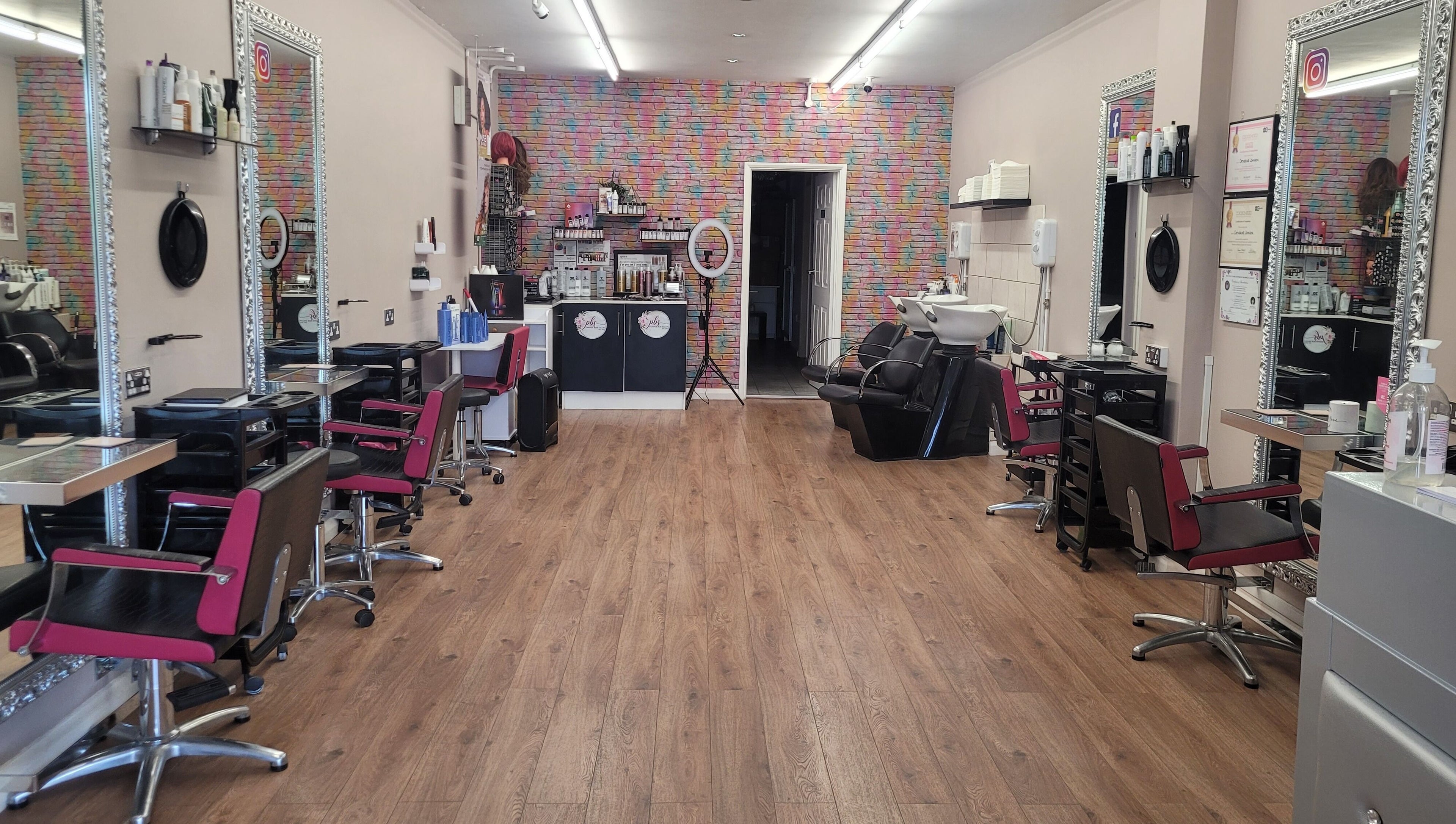 Elegant interior of Pamper Box Salon in Harlow, England, GB featuring styling stations and modern decor.