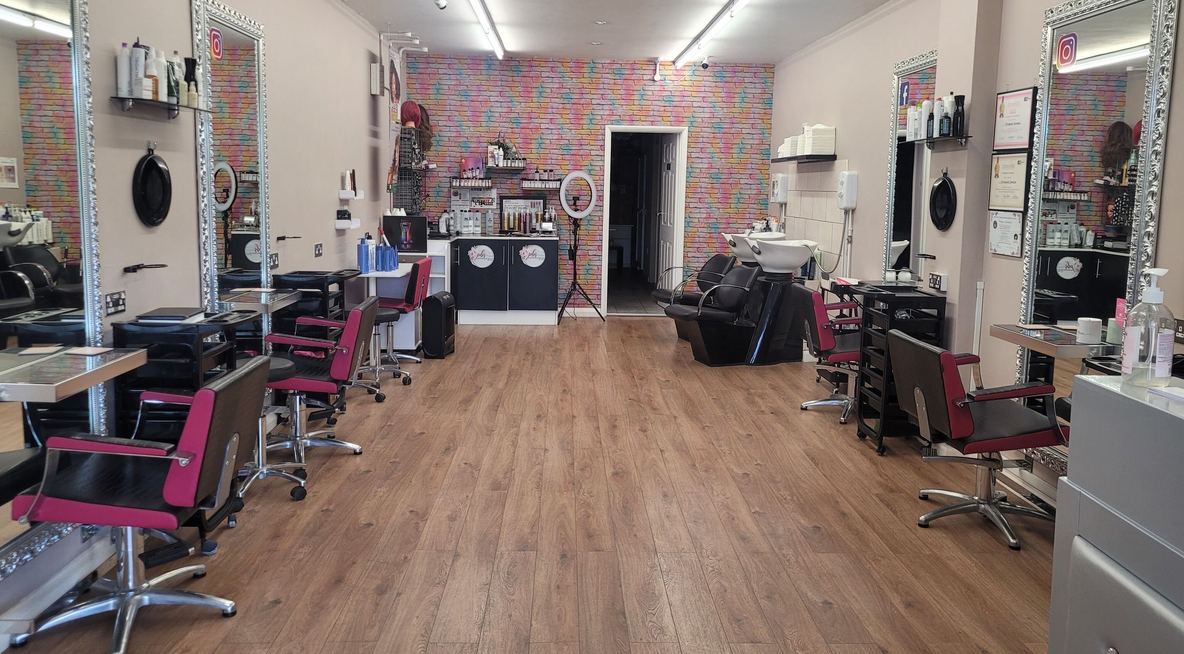 Elegant interior of Pamper Box Salon in Harlow, England, GB featuring styling stations and modern decor.