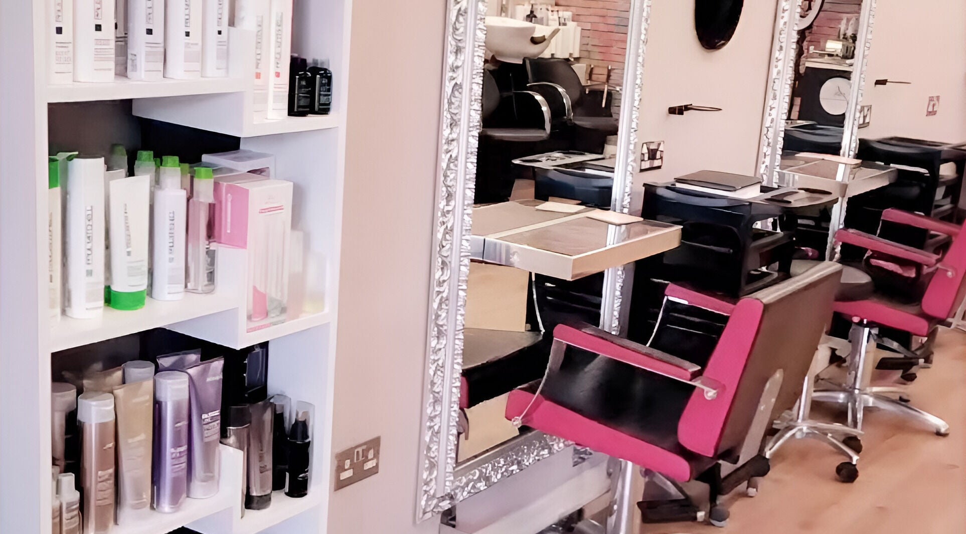 Pamper Box Salon in Harlow, England, GB. Modern styling stations with mirrors and products displayed.