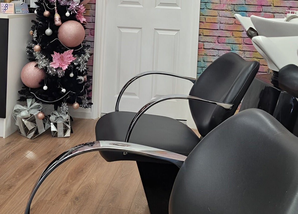 Chic and cozy salon chairs at Pamper Box Salon, Harlow, England, GB, adorned with festive decor.