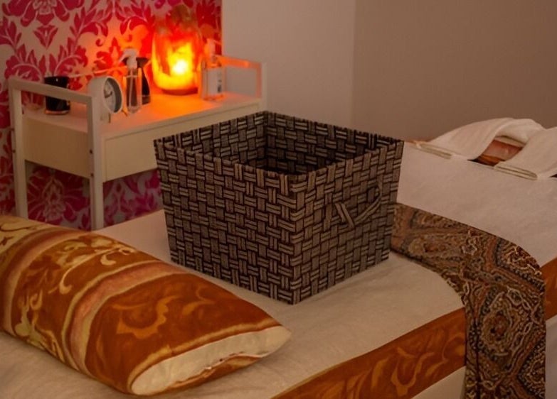 Tranquil therapy bed setup at Borneo Bali Day Spa, Carlisle, Western Australia, AU with warm lighting and decor.
