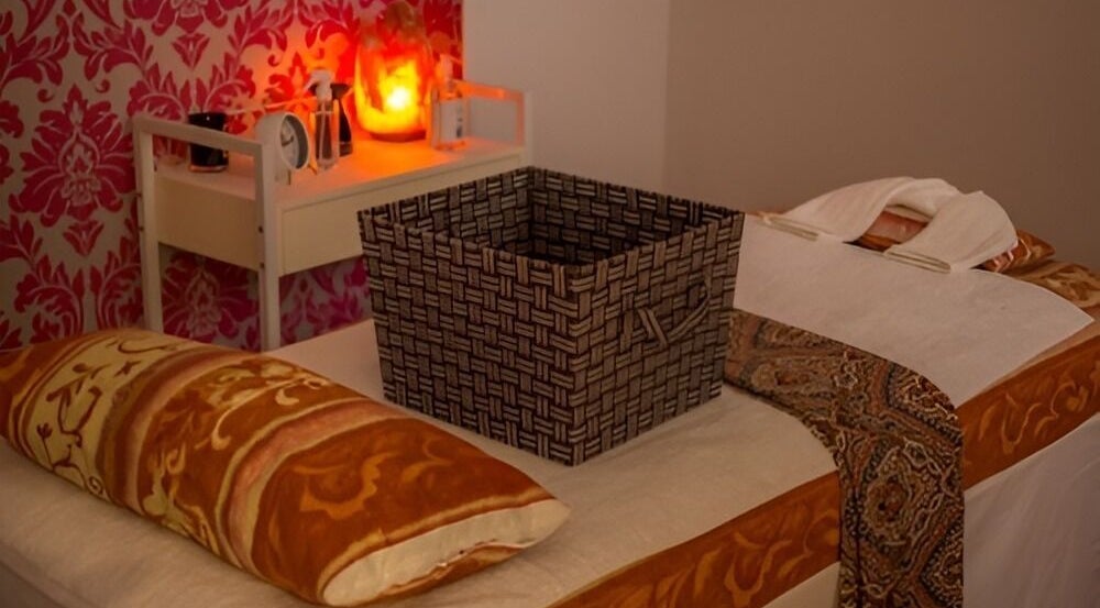 Tranquil therapy bed setup at Borneo Bali Day Spa, Carlisle, Western Australia, AU with warm lighting and decor.