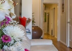 Blooming bouquet graces Borneo Bali Day Spa in Carlisle, Western Australia, enhancing the relaxing hallway ambiance.