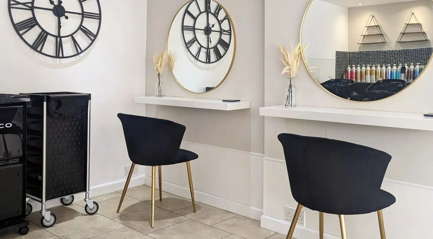 Elegant seating and mirrors at Haylo Hair, Southampton, England, GB. Stylish salon interior with modern design.