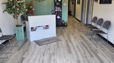 Reception area at Shanna Massage Therapy in Independence, Missouri, US with elegant decor and seating.