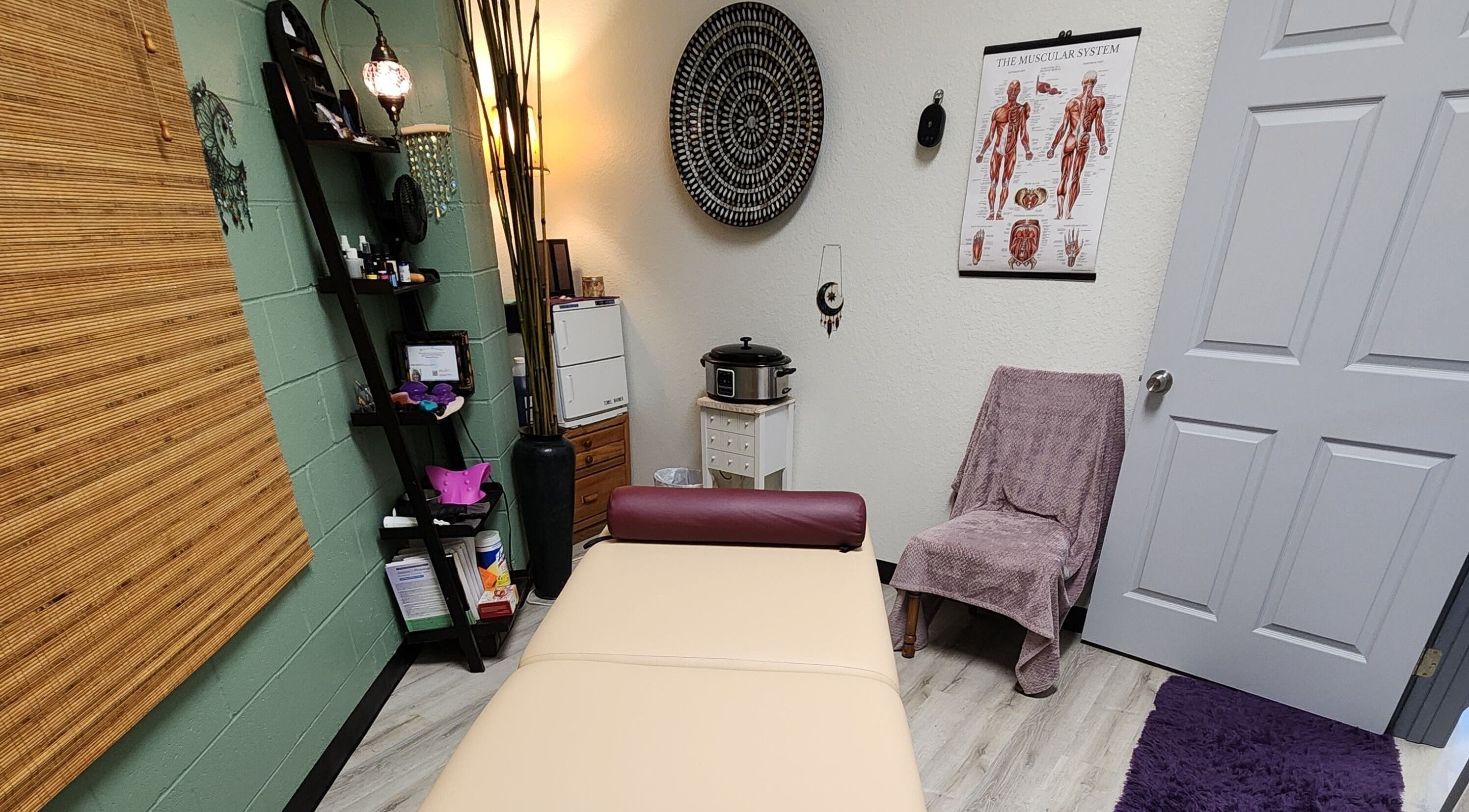 Relaxing massage room at Shanna Massage Therapy in Independence, Missouri, US, with cozy decor.