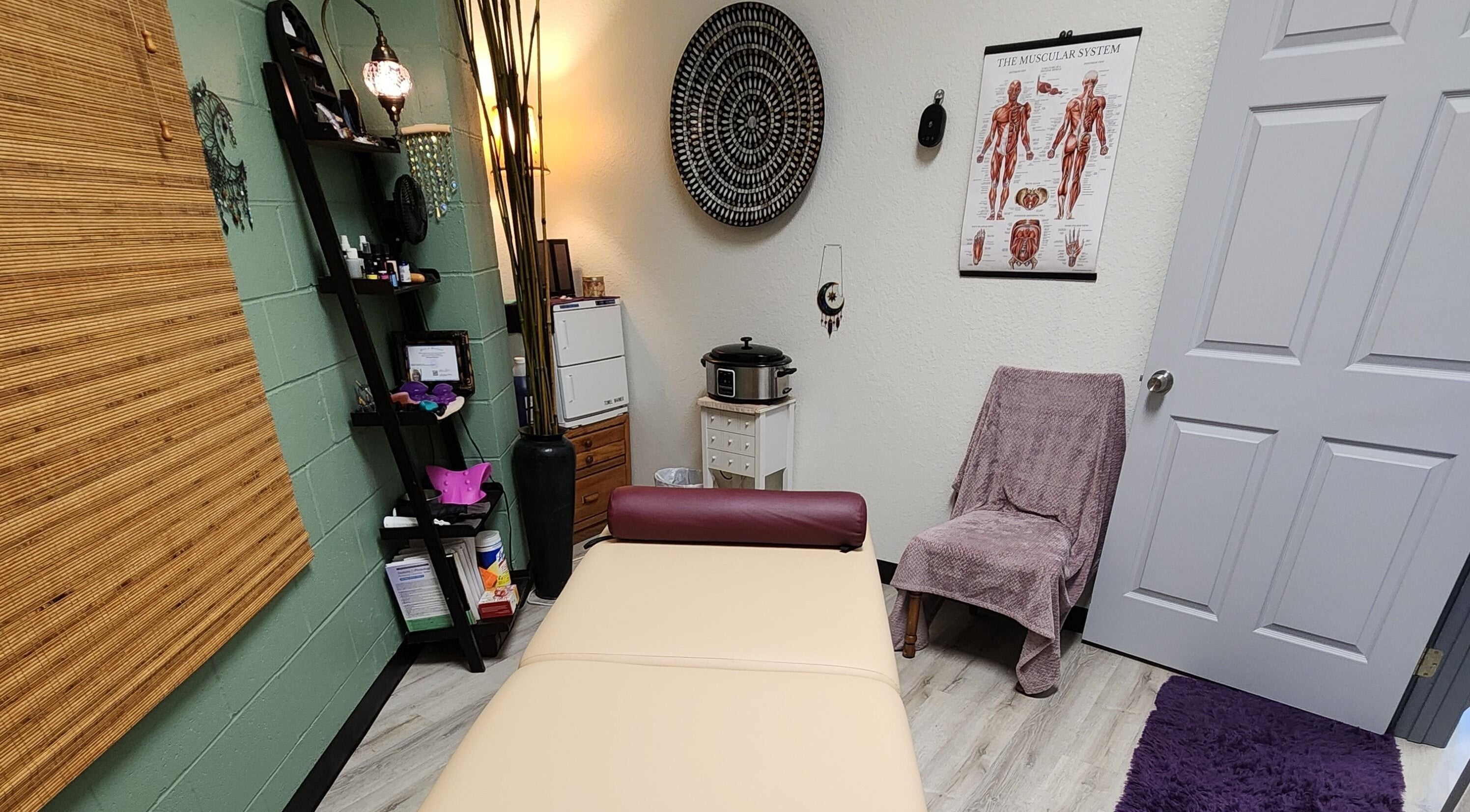 Relaxing massage room at Shanna Massage Therapy in Independence, Missouri, US, with cozy decor.