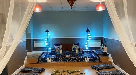 Relaxing therapy room at Zilda Holistic Therapies, Dunfermline, Scotland, GB, featuring blue decor and cozy seating.
