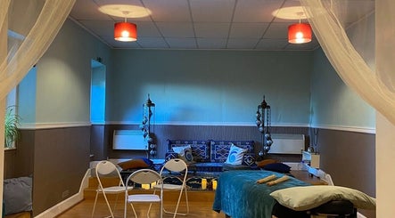 Relaxing therapy room at Zilda Holistic Therapies, Dunfermline, Scotland, GB with cushions and ambient lighting.