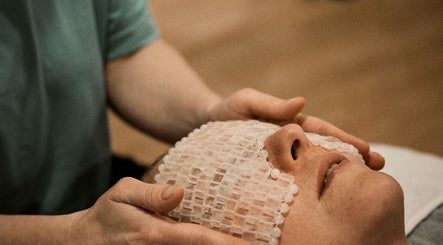 Client enjoying a soothing facial treatment at Zilda Holistic Therapies, Dunfermline, Scotland, GB.