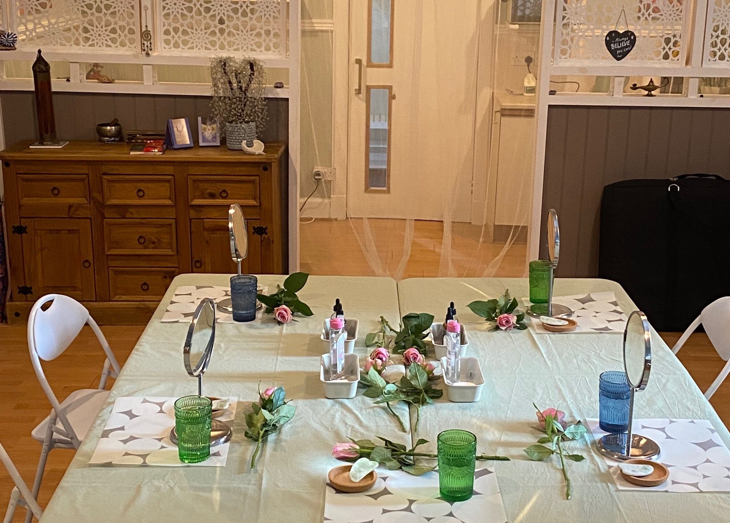 Inviting therapy setup at Zilda Holistic Therapies in Dunfermline, Scotland, GB with mirrors and flowers.