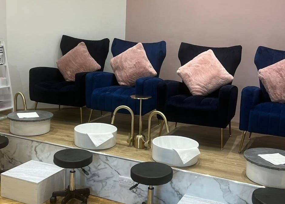 Luxurious pedicure area at The Beauty Room in Spalding, England, GB with plush seats and foot basins.