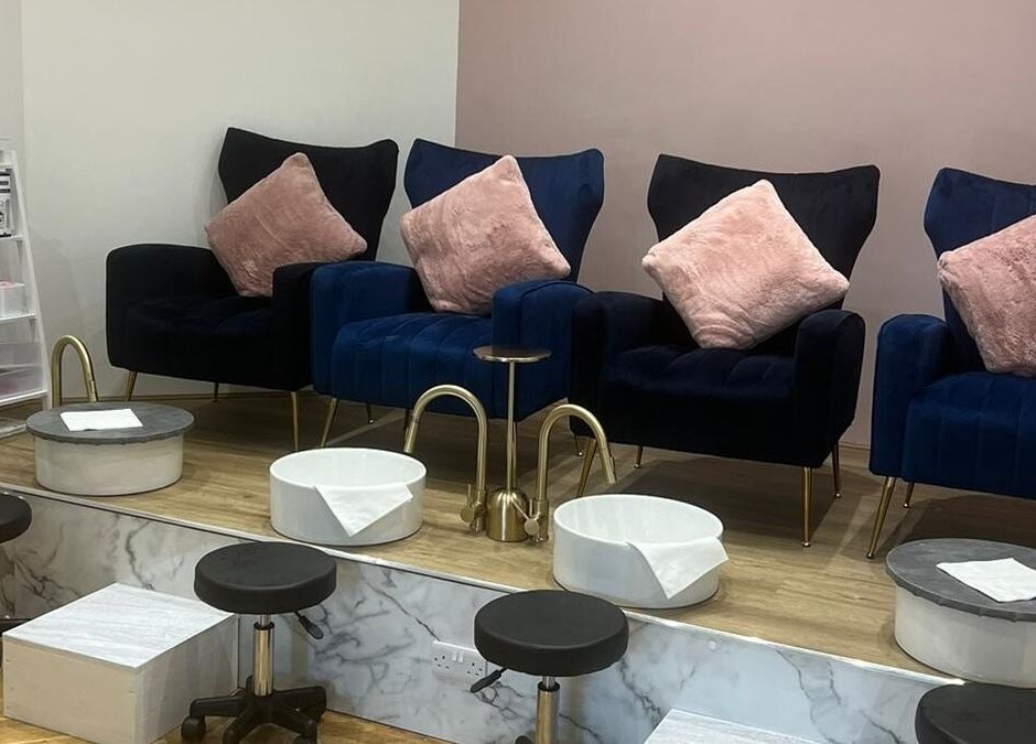 Luxurious pedicure area at The Beauty Room in Spalding, England, GB with plush seats and foot basins.