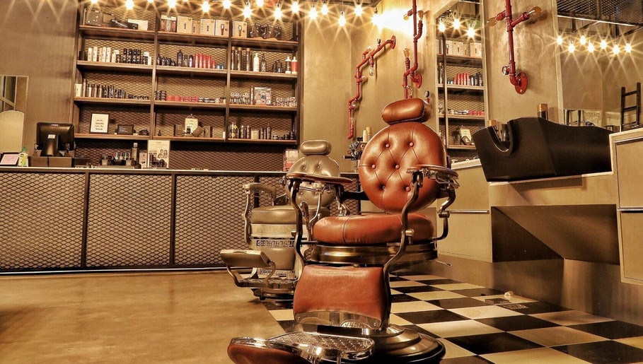 Classic barbershop chairs at Sharqi Gents Salon in Sharjah, AE, offering a luxurious grooming experience.