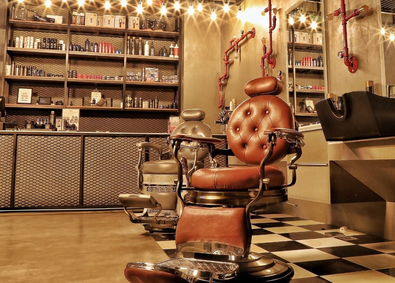 Classic barbershop chairs at Sharqi Gents Salon in Sharjah, AE, offering a luxurious grooming experience.