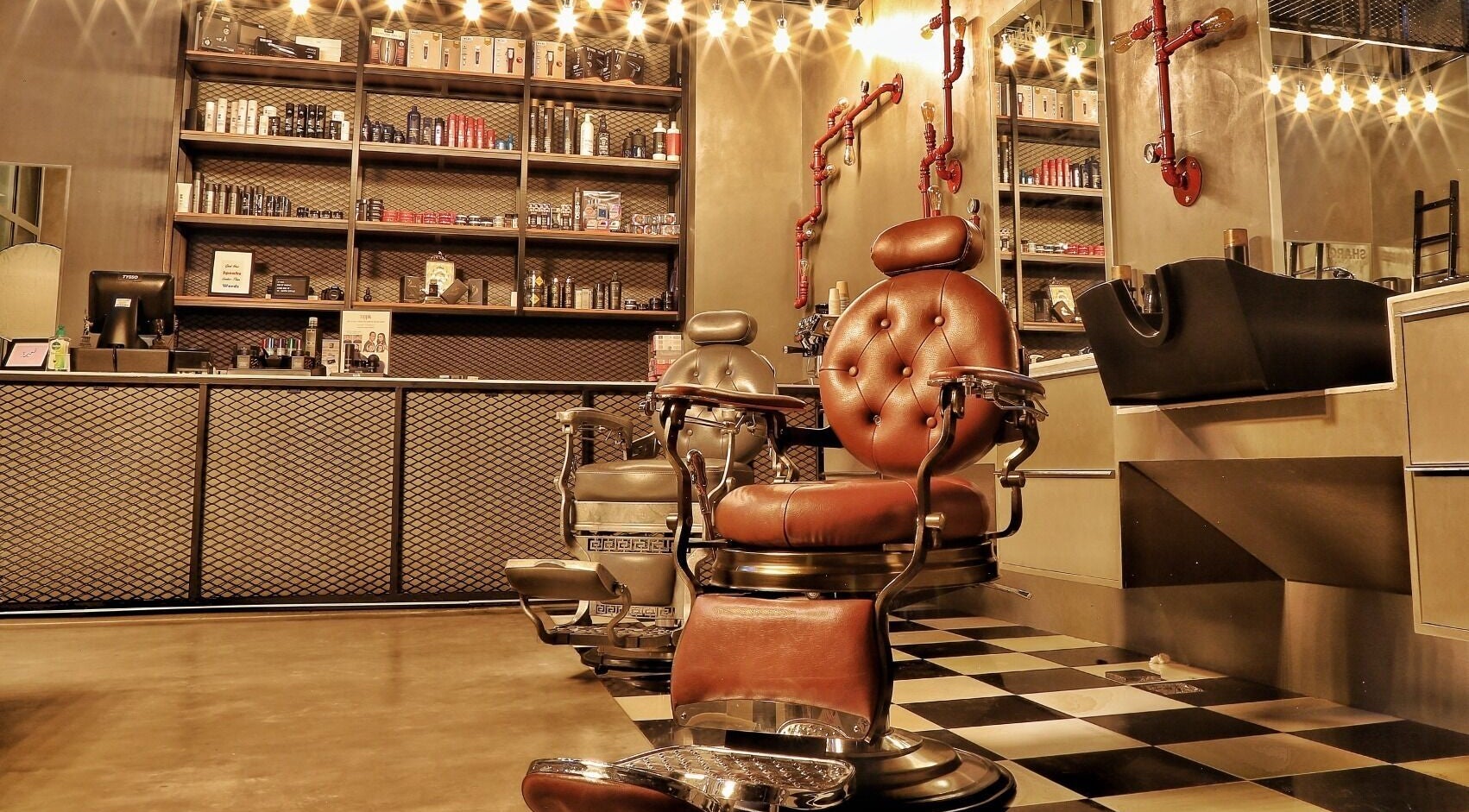 Classic barbershop chairs at Sharqi Gents Salon in Sharjah, AE, offering a luxurious grooming experience.