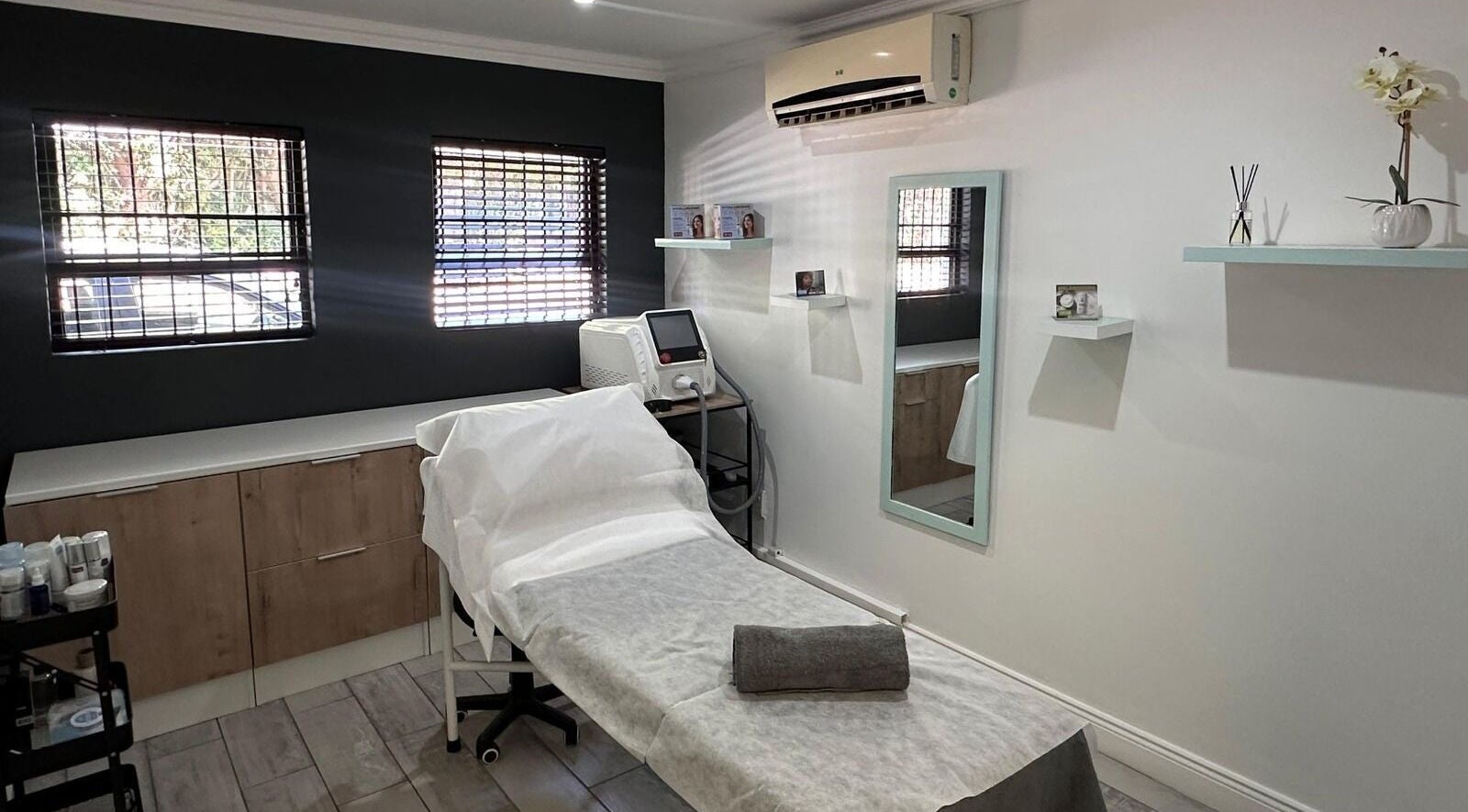 Serene treatment room at Cleanse Moreleta Park, Pretoria, Gauteng, ZA, featuring a comfortable bed and modern decor.