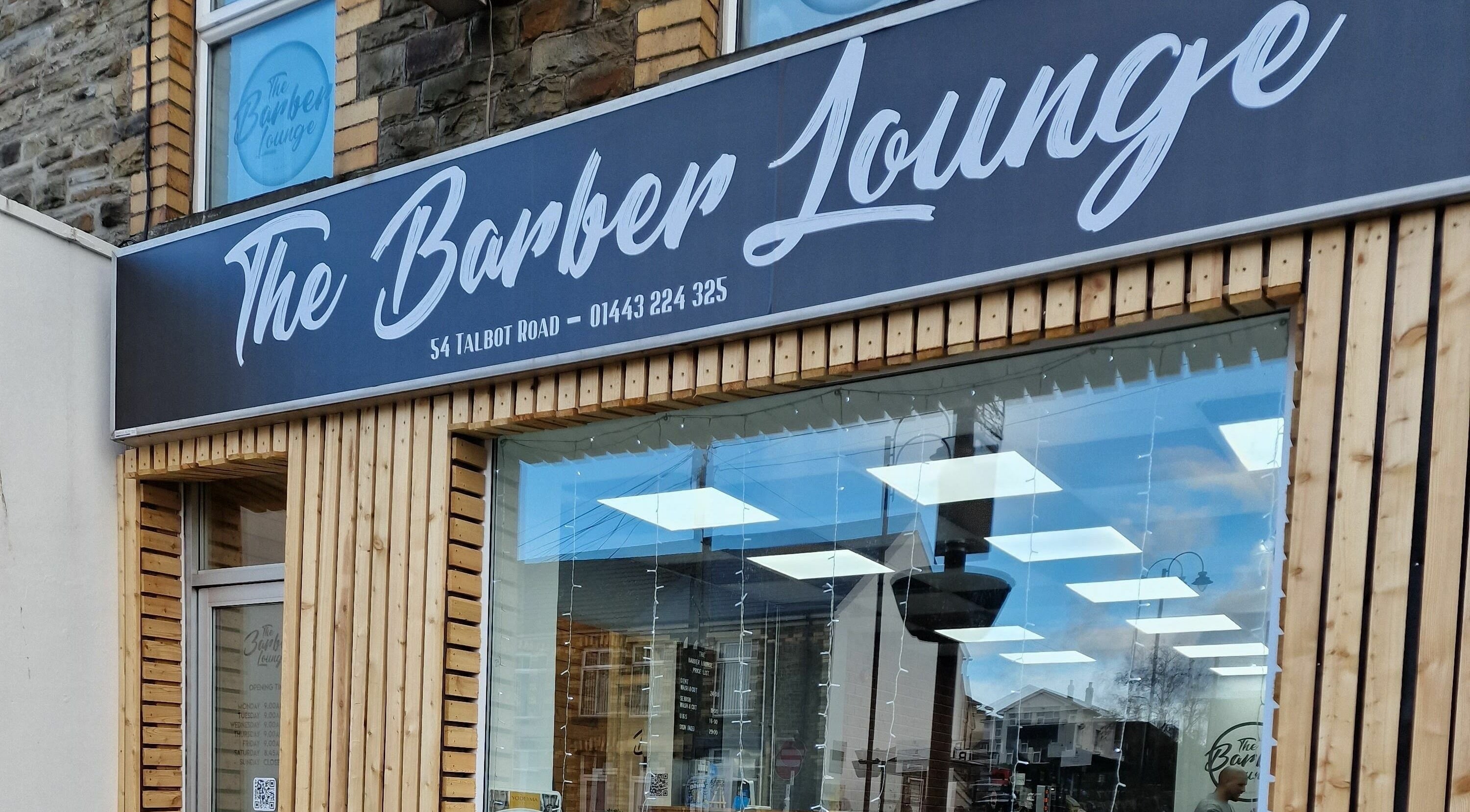 The Barber Lounge shopfront in Talbot Green, Wales, GB, showcasing a modern and inviting exterior design.