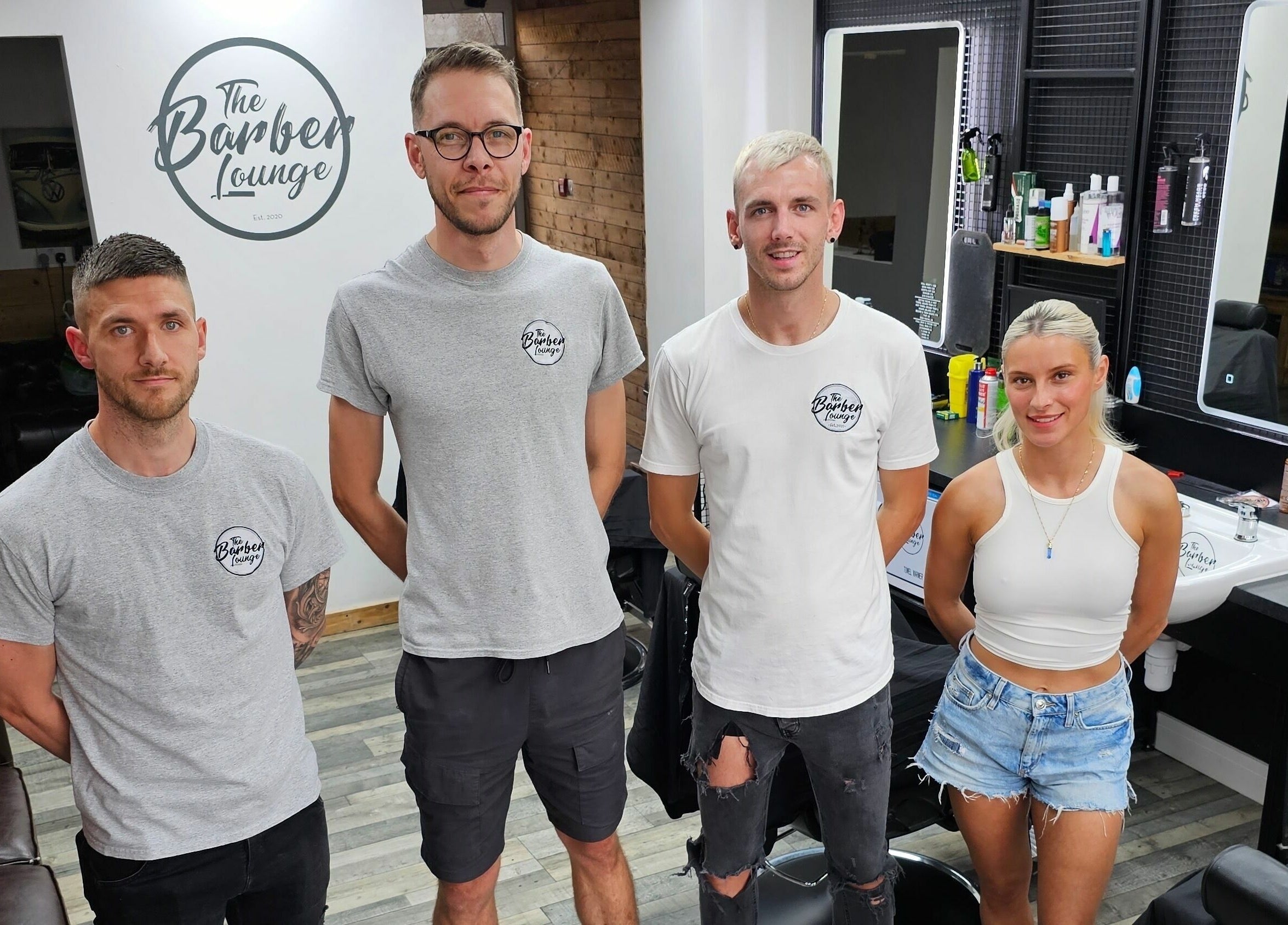 The Barber Lounge team inside their Talbot Green, Wales, GB location, ready to provide exceptional service.