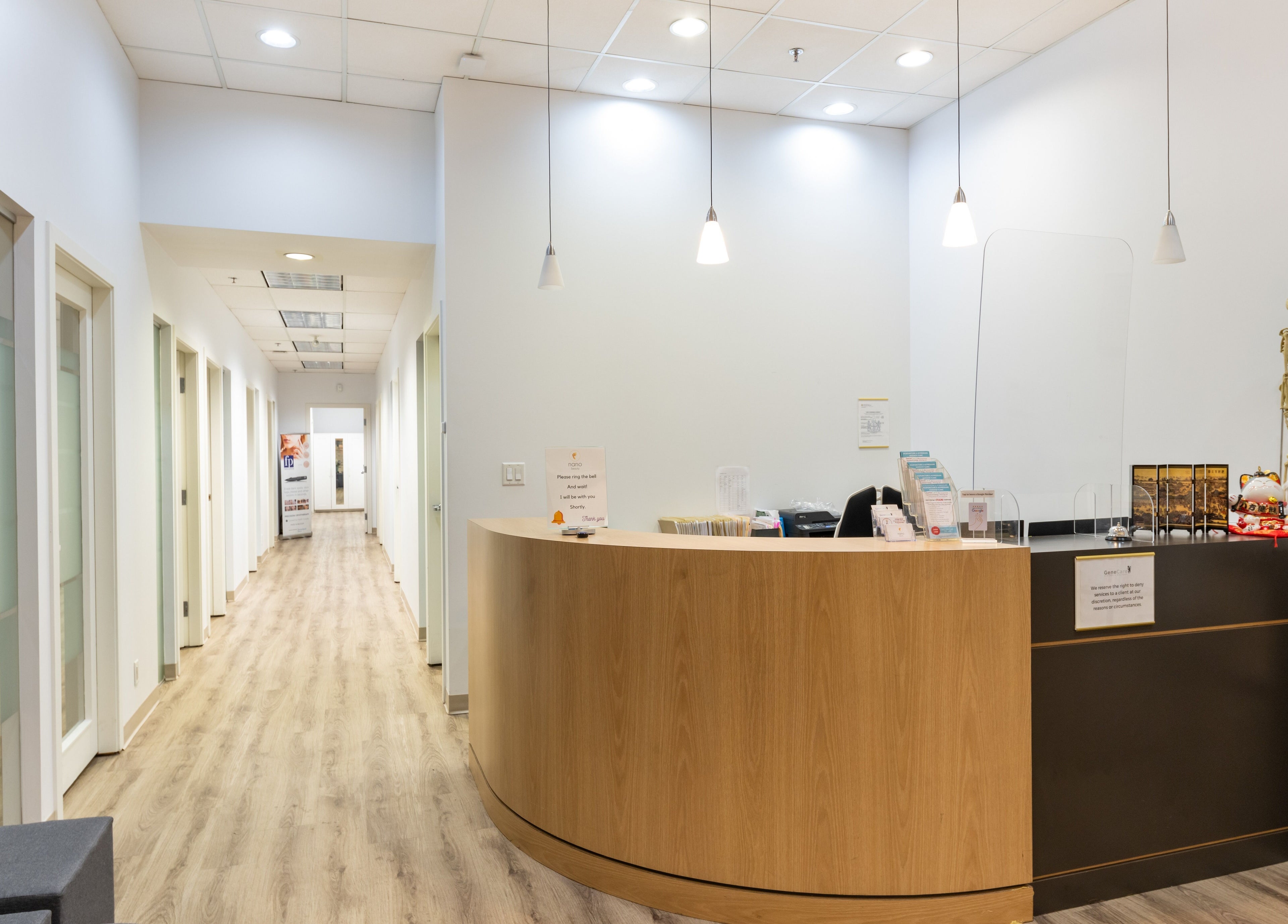 Spacious Nano Beauty reception area in New Westminster, British Columbia, CA with modern decor and warm lighting.