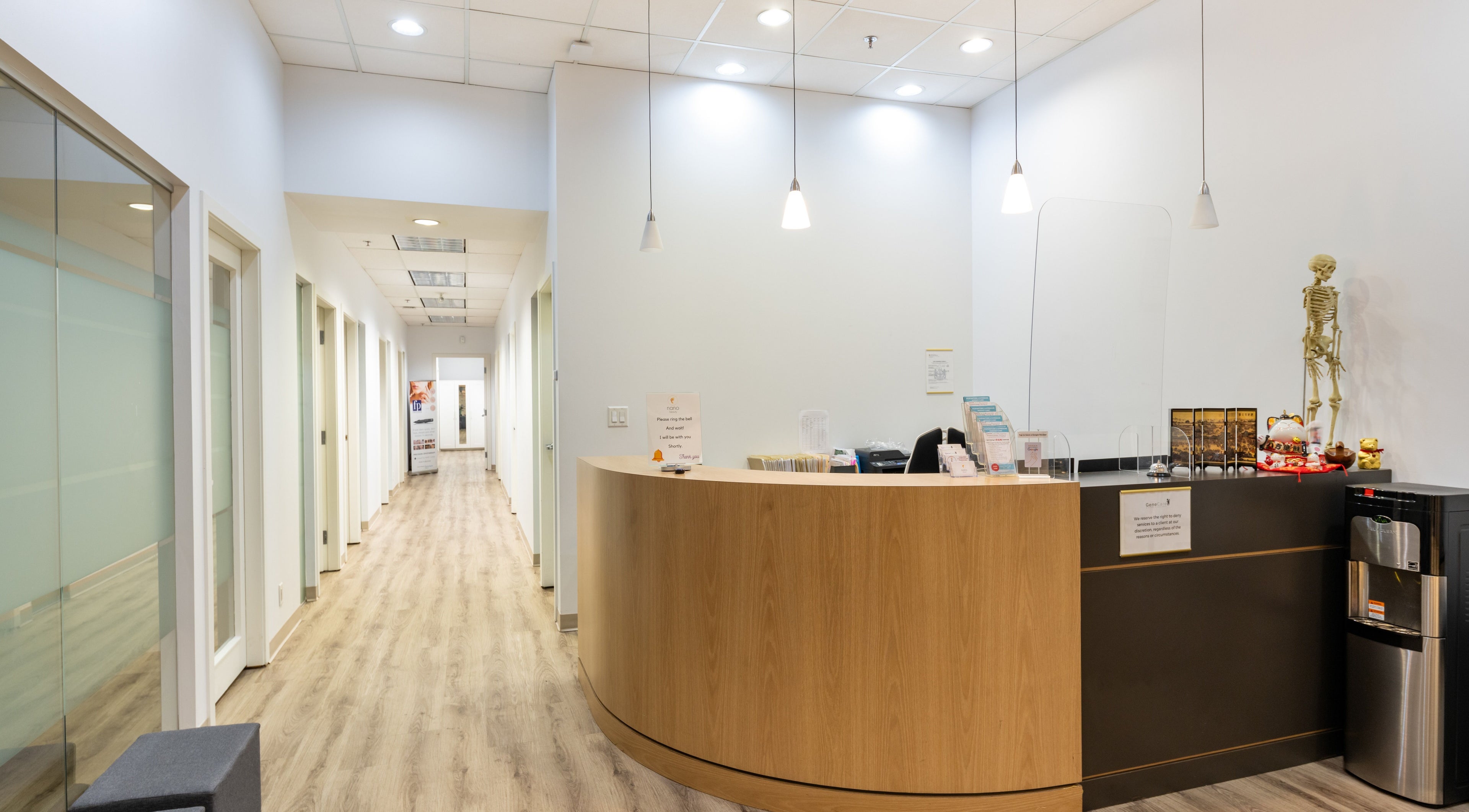 Spacious Nano Beauty reception area in New Westminster, British Columbia, CA with modern decor and warm lighting.