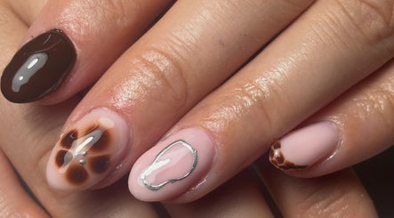 Elegant gel nail designs at Gelled By Hayley, Birmingham, England, GB, featuring glossy and artistic patterns.