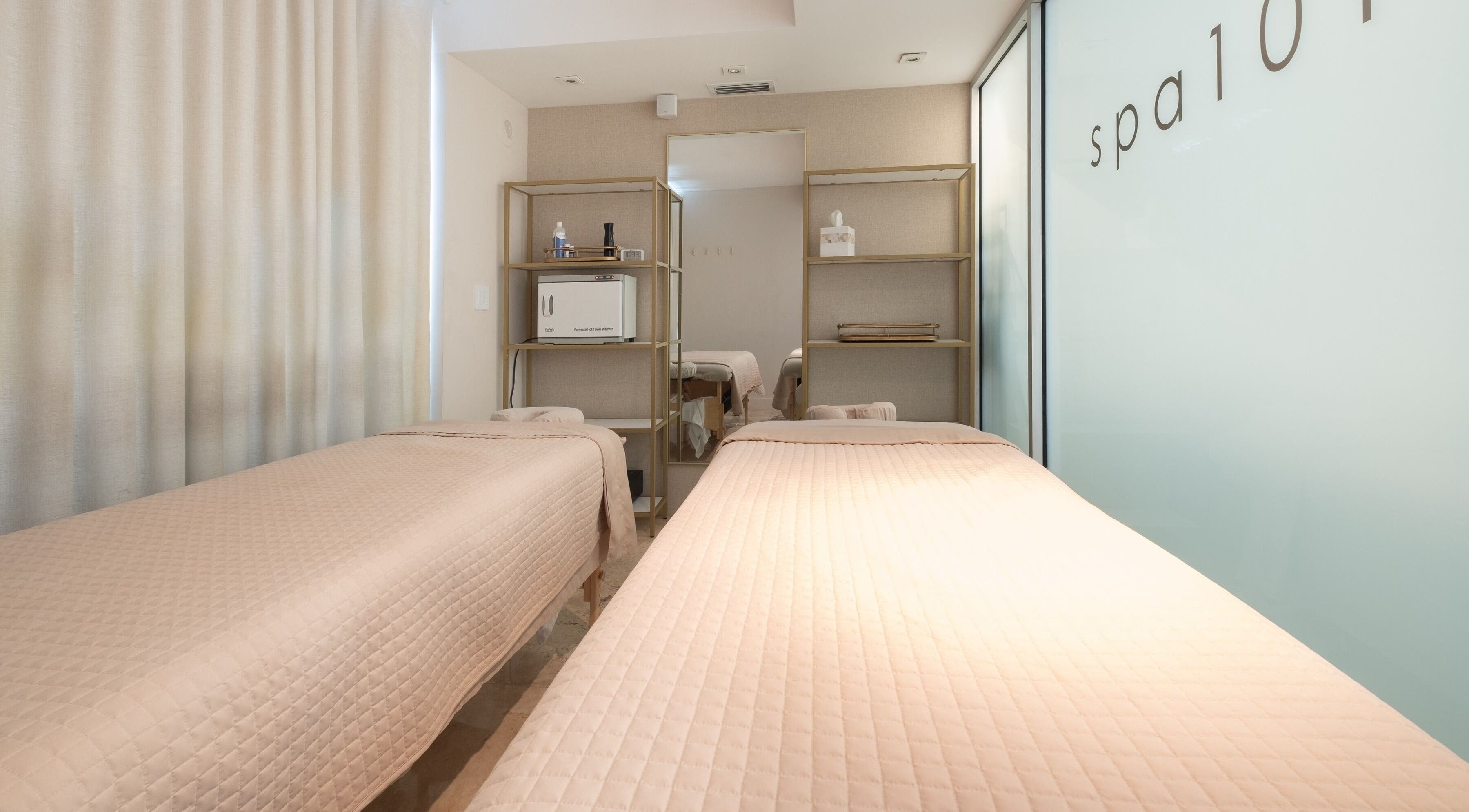 Peaceful spa room at SPS101 - Hilton Bentley Miami Beach, Miami Beach, Florida, US with twin massage tables.