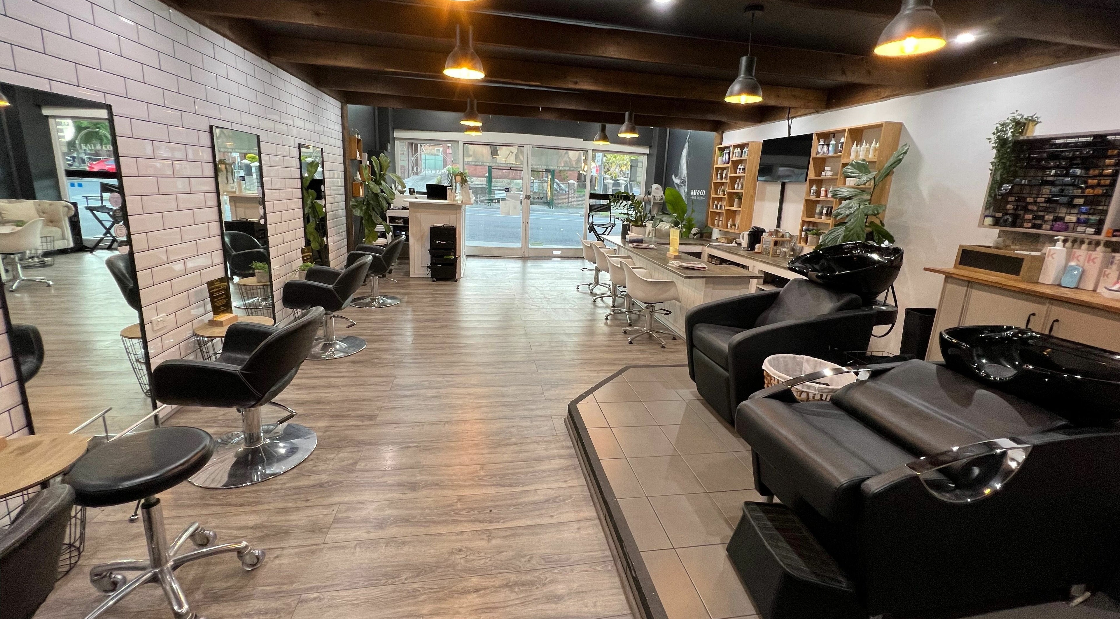 Spacious interior of Kai and Co. Hair Salon, Bexley, New South Wales, AU with stylish seating and modern decor.